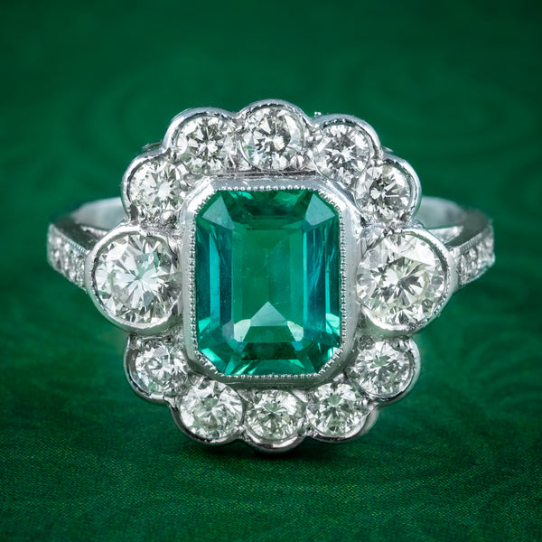 Emerald and store diamond cluster ring